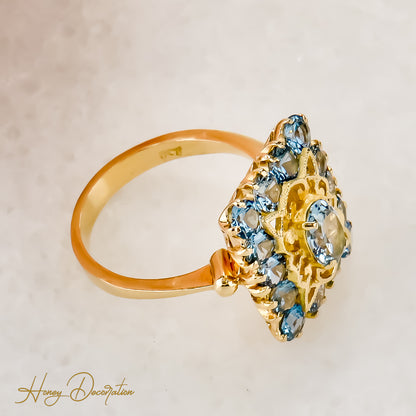 Vintage gold ring made of 18 carat yellow gold cast with blue gemstones