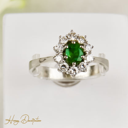 Entourage ring with emerald & brilliant from 18 karat gold