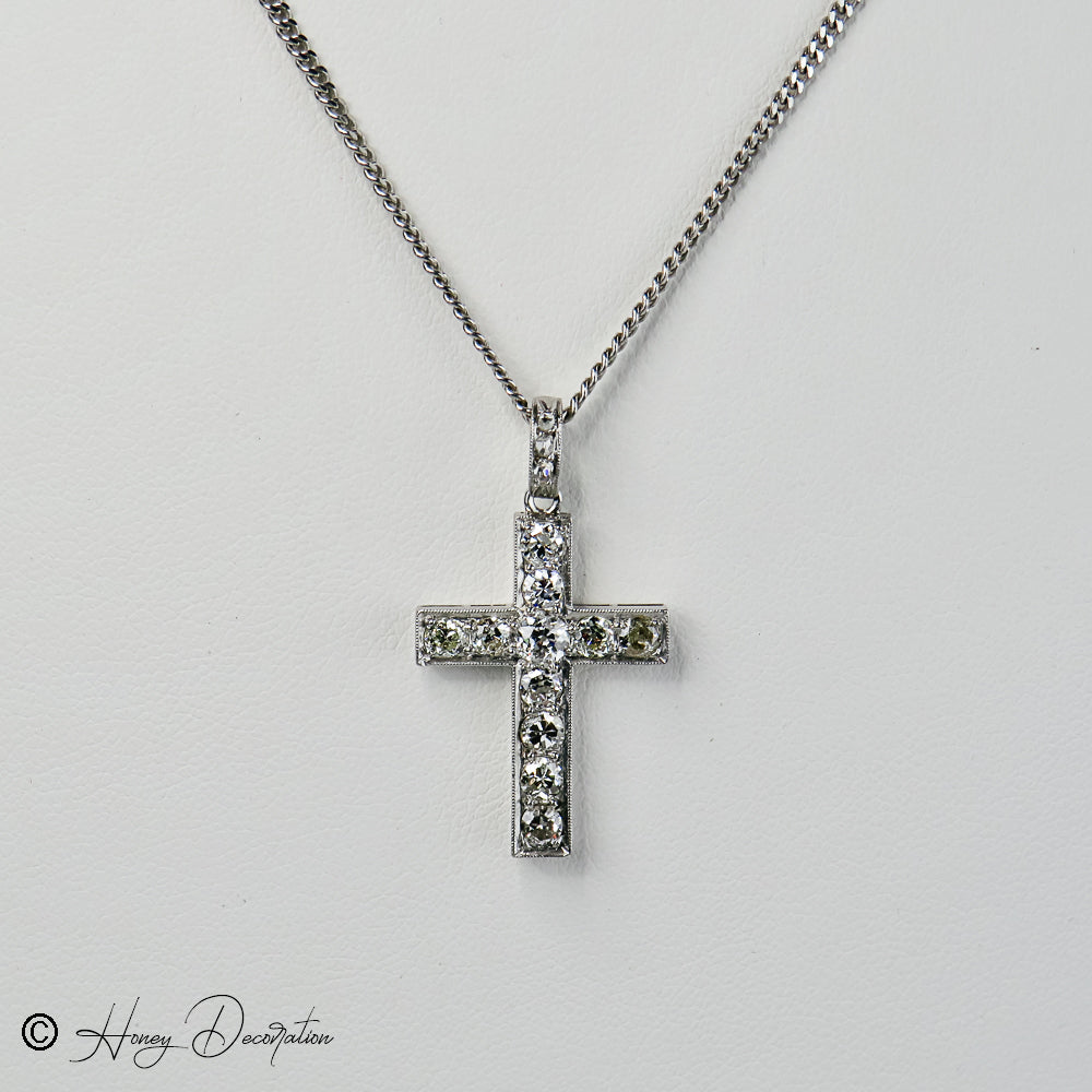 Antique cross trailer made of 14 karat white gold with brilliant