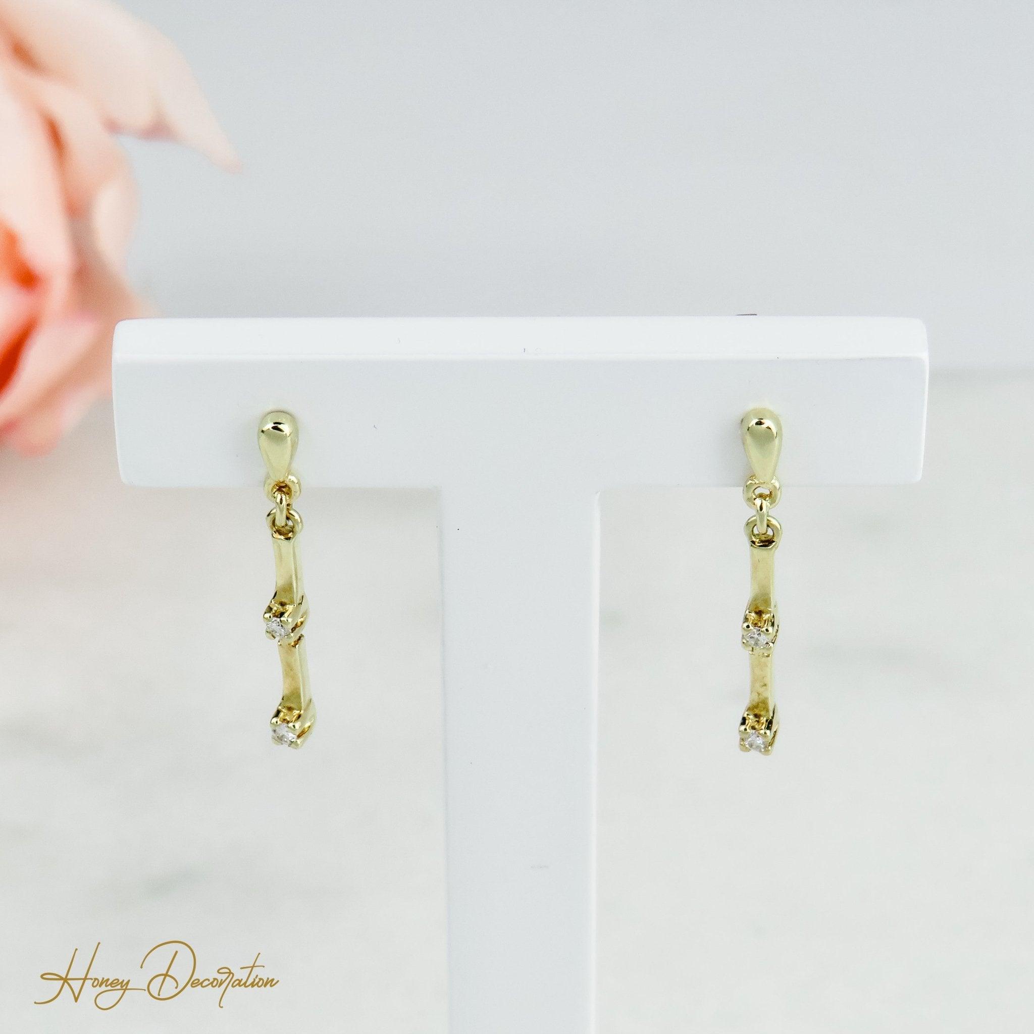 Elegante Goldohrringe mit Diamanten - Honey Decoration