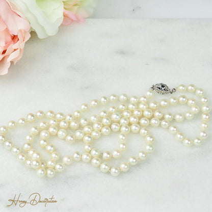 Lange Perlenkette mit 585 Weißgoldschließe - Honey Decoration